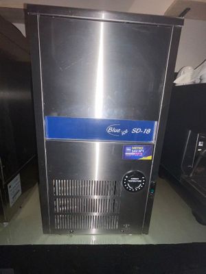 an image of a stainless steel ice machine on a counter