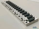 an image of a piano keyboard on a white surface