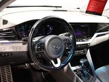 the interior of a car with a steering wheel and dashboard controls