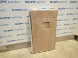 a cardboard box sitting on the floor in front of a wall