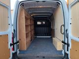 a white van that is open with the door open