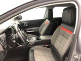 the interior of a car with a steering wheel and a dashboard