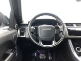 the interior of a car with a steering wheel and dashboard controls
