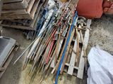 a pile of wood and tools sitting on the ground