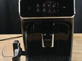 a coffee machine that is sitting on a wooden table