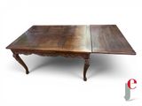 an image of a table with two leaves on top of it