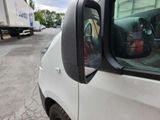 an image of a car that is parked on the side of the road