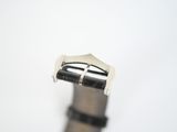 a close up picture of a watch on a white surface