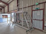 a picture of a ladder in a building with a sign on the wall