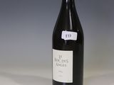 a bottle of wine that is sitting on a table