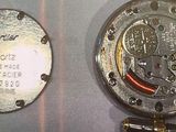 two watches that are on display in a glass case