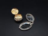 three silver and gold lockes on a black background