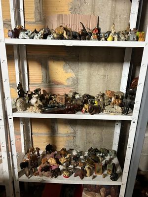 a lot of toy figurines on the shelves in the room
