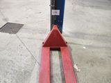 a forklift that is sitting on the ground in the garage