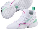 a pair of white sneakers with pink and green accents