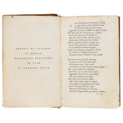 an open book with a poem written in it on a white background