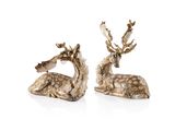 pair of silver deer figurines on a white background