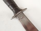a knife that is laying on a table