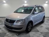 the silver van is parked in a large room with checkered floor