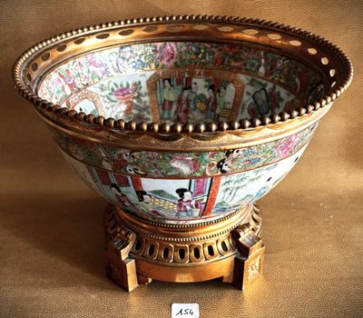 a bowl that is sitting on a stand on a table