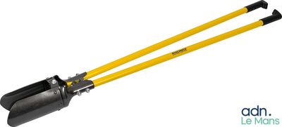 a pair of black and yellow shovels sitting on top of each other