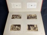 an open book with pictures of a family in it on a table