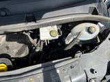 a close up of a car ' s engine with the hood open