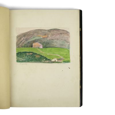 an open book with a drawing of a landscape in it