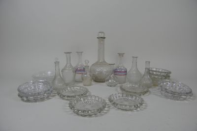 a lot of glass vases and bowls on the table