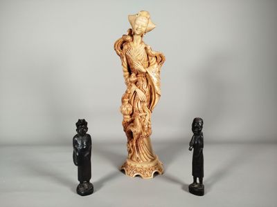 two figurines of a woman and a man standing next to each other