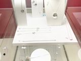 a display case with jewelry on it in a glass case
