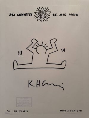 a white sheet with a drawing of a person on it