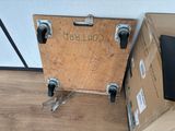 a wooden box that is sitting on the floor next to a box
