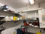 a kitchen with a lot of dishes and dishes on the shelves