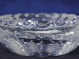 a glass bowl that is sitting on a table