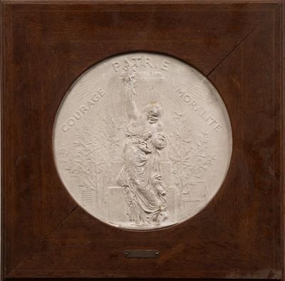 a white relief of a woman holding a child in a wooden frame