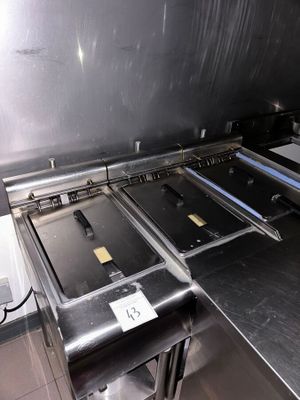 stainless steel counter top in a commercial kitchen with a lot of counter space