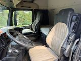 a view of the inside of a van with the driver ' s seat up