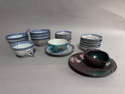 many plates and cups sitting on the table together