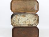 three pieces of old metal are stacked on top of each other
