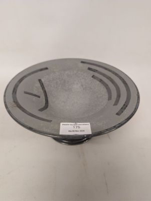 an image of a black and white bowl on a white surface