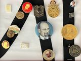 a picture of a collection of medals and medals on a black ribbon