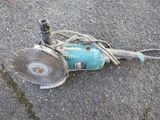 a blue machine that is laying on the ground