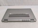 a laptop that is sitting on a white surface