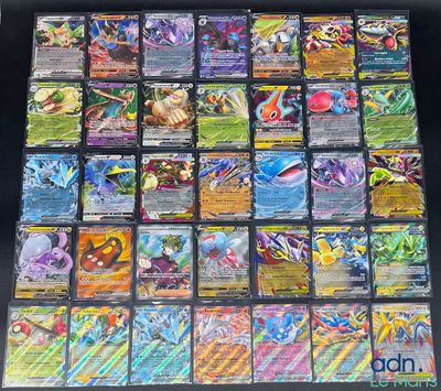 a close up of a bunch of pokemon cards sitting on top of a table