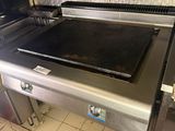 stainless steel counter top in a commercial kitchen with tile flooring