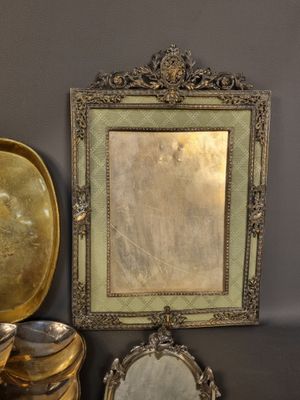 a picture of a mirror, a bowl, and a plate on a table