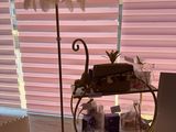a table with a cake and a lamp on it