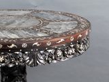a table with a marble top on a stand