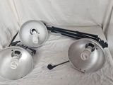 three lights that are sitting on a chair